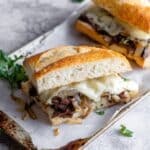 Steak Sandwich with Herb Butter, Caramelized Onions, and Melted Havarti Recipe