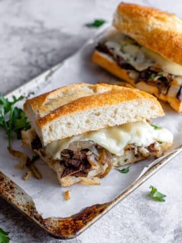 Steak Sandwich with Herb Butter, Caramelized Onions, and Melted Havarti Recipe