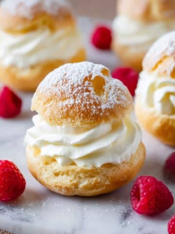 Classic Cream Puffs with Vanilla Whipped Cream and Fresh Raspberries Recipe