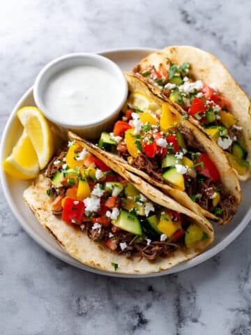 Honey Garlic Shredded Beef Tacos with Roasted Vegetables and Feta Recipe
