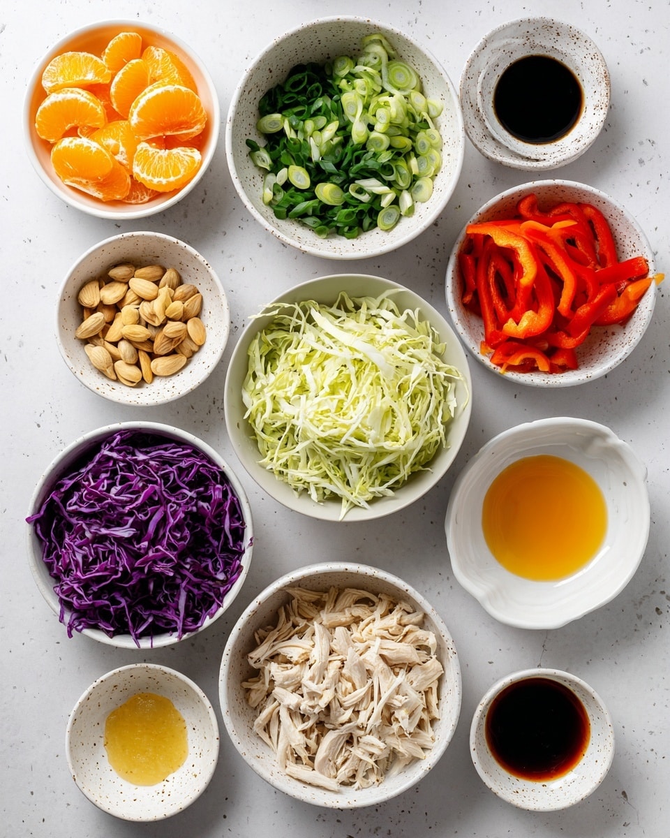 The image shows a collection of ingredients arranged on a white marbled surface. There are eleven white bowls and one white speckled bowl, each containing a different food item. Starting from the top left, the first bowl holds bright orange mandarin orange segments, next to it is a bowl with dark green sliced green onions, and to the right, a white speckled bowl with vibrant red sliced bell pepper strips. Below the mandarin oranges, a white bowl is filled with finely shredded purple-red cabbage, while directly below the green onions is a small bowl with whole almonds. Next to the almonds is a large white bowl filled with chopped light green napa cabbage. Below the cabbage, a bowl contains thin julienned bright orange carrots. Near the center are four small white bowls containing dark brown sesame oil, bright orange liquid orange juice, light golden honey, and almost clear rice vinegar. To the right is another white bowl with shredded light beige chicken. Below are two small white bowls filled with chopped white garlic and chopped pale yellow ginger, respectively, and a bowl with very dark tamari sauce. All items are neatly arranged without overlap. Photo taken with an iphone --ar 4:5 --v 7