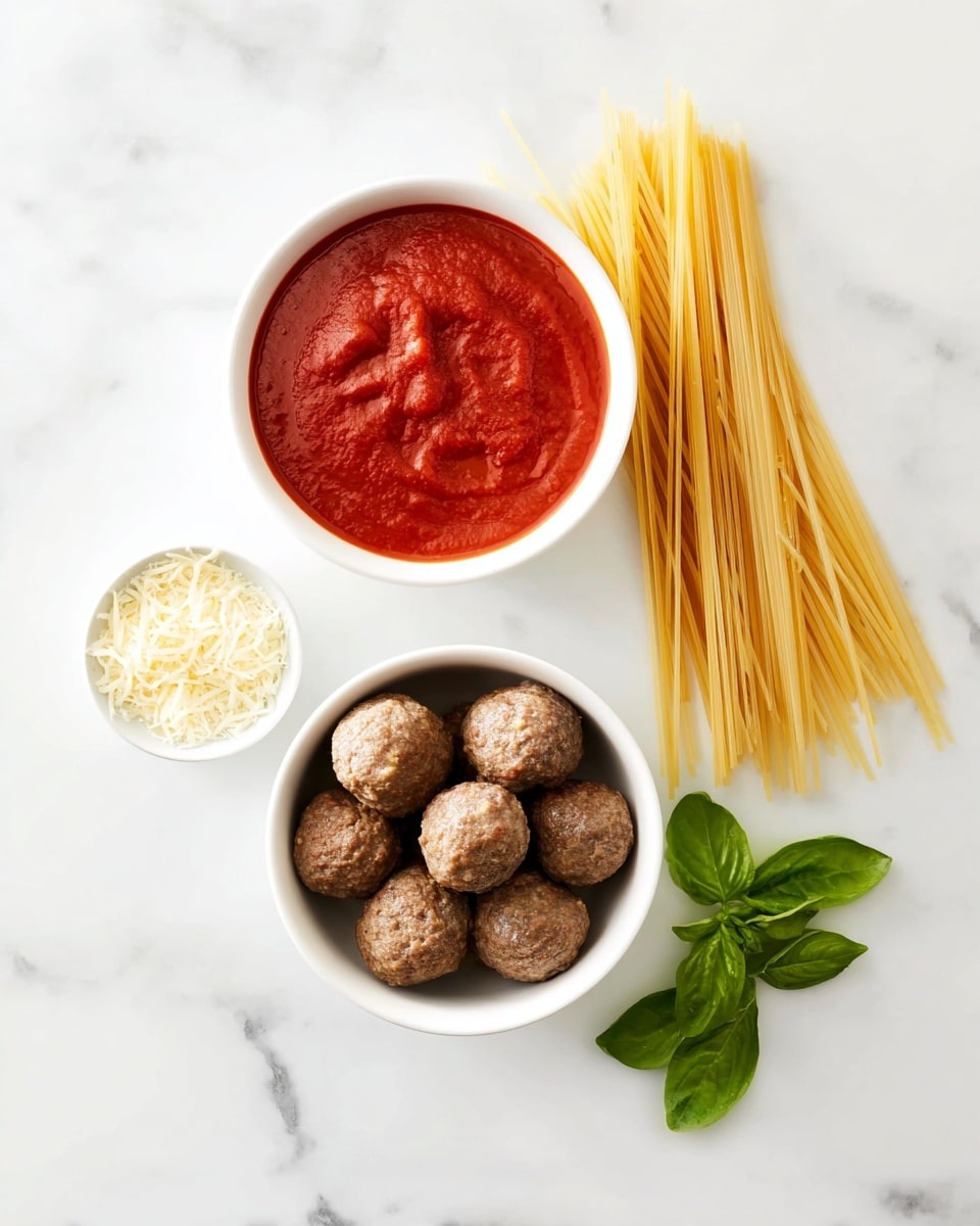 The image shows a white marbled surface with four main elements arranged neatly. On the top left, there is a white bowl filled with red marinara sauce, thick and smooth in texture. Below this bowl, another white bowl holds about fifteen cooked meatballs, brown and round with a slightly rough surface. To the right of the sauce bowl, a pile of dry, uncooked spaghetti stands upright, pale yellow and smooth. At the bottom right, three fresh green basil leaves lie flat on the white marble. To the left of the meatballs, a small white bowl is filled with finely grated light yellow Parmesan cheese. Photo taken with an iphone --ar 4:5 --v 7