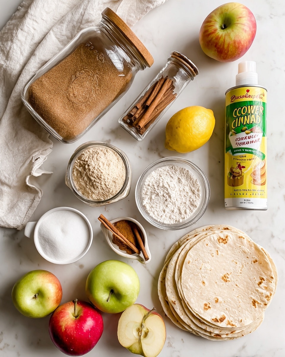 The image shows various cooking ingredients arranged on a white marbled surface with a soft white cloth underneath some items. There is a tall glass jar with a wooden lid tilted on its side, filled partially with brown sugar. Next to it, a small jar of ground cinnamon stands upright beside a lemon. A white cup filled with sugar sits nearby, along with a small white bowl holding cornstarch. Three apples—two red and one green—are scattered around the scene, alongside a stack of four pale flour tortillas positioned on the right side. A can of cooking spray with a green and yellow label is placed near the top right corner. Each item is clearly labeled with black text on white backgrounds. Photo taken with an iphone --ar 4:5 --v 7