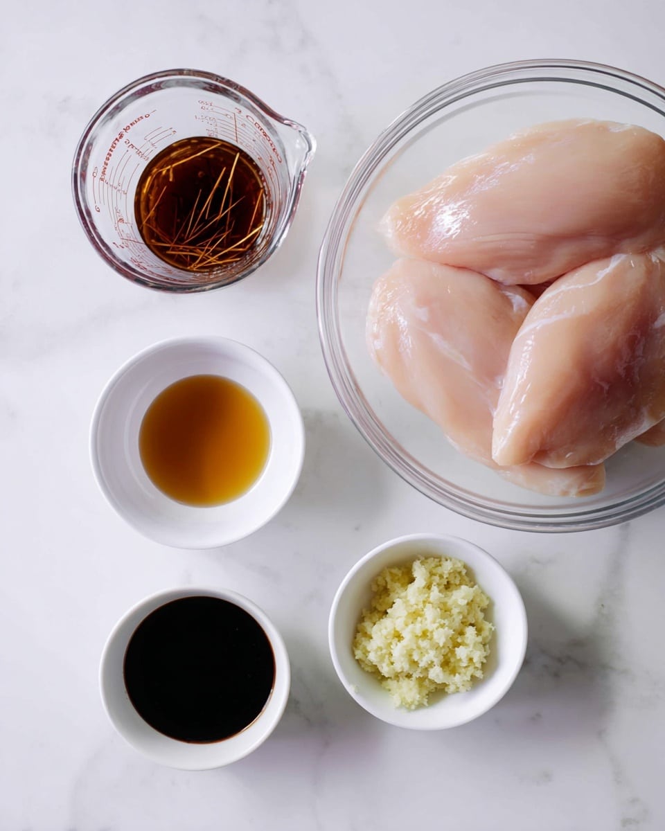 A clear glass bowl on the right holds two large, pale pink raw chicken fillets with a smooth, slightly shiny surface. To the left, four small white bowls and a clear glass measuring cup are arranged on a white marbled surface. The top left measuring cup holds a dark brown liquid with thin strips (possibly ginger or garlic). Below it, a small white bowl contains a light amber liquid, while the small white bowl beneath holds a very dark, almost black liquid that appears thick. The bottom most small white bowl contains finely grated pale yellow and light green pastes, likely ginger and garlic, with a soft, moist texture. photo taken with an iphone --ar 4:5 --v 7