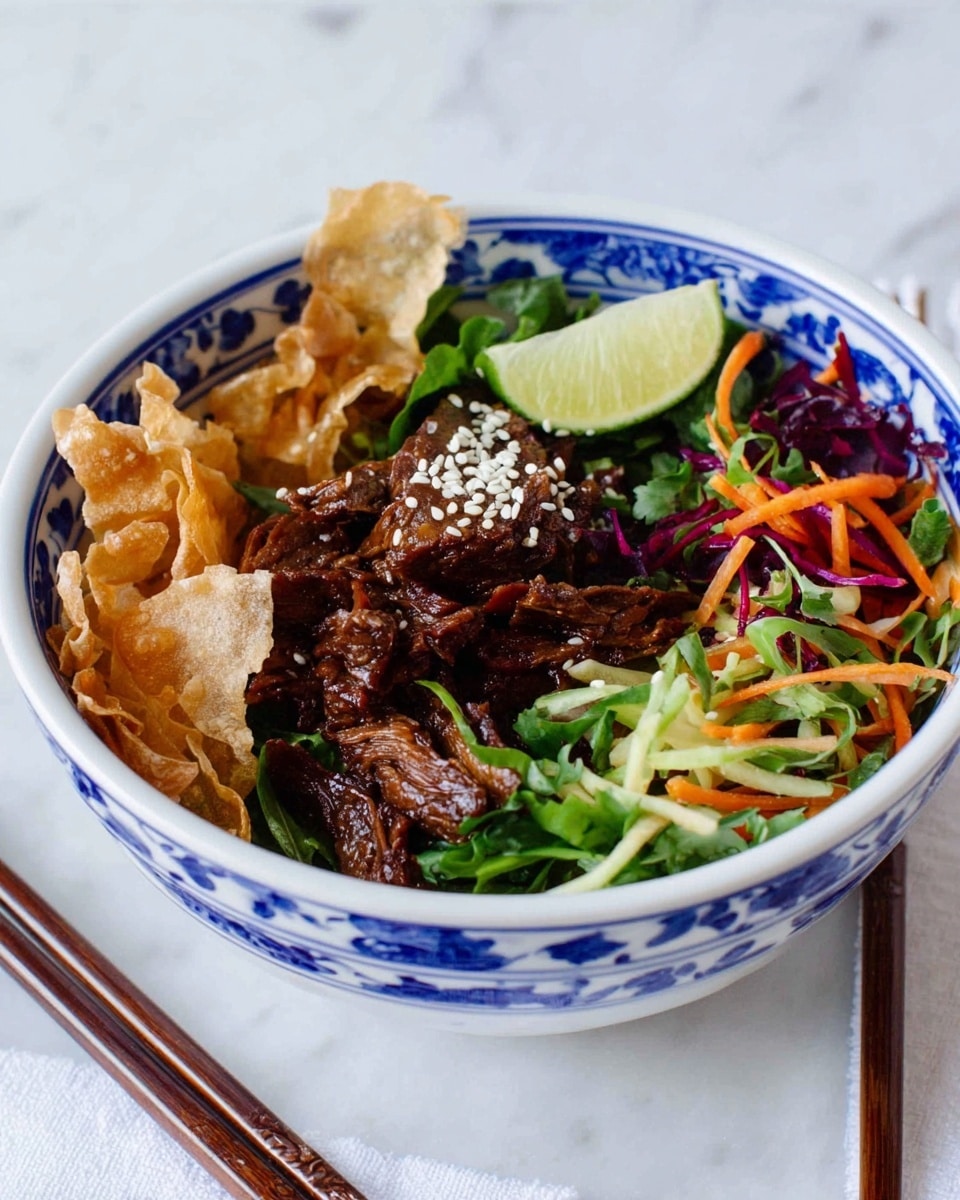 A white bowl with blue floral patterns holds a layered dish starting with crispy light brown strips on one side, next to dark brown cooked meat topped with white sesame seeds in the center. On the other side, there is a mix of thinly sliced bright green and orange vegetables with some purple leafy bits, all topped with a lime wedge. The bowl sits on a white marbled surface with a pair of dark brown chopsticks beside it. Photo taken with an iphone --ar 4:5 --v 7