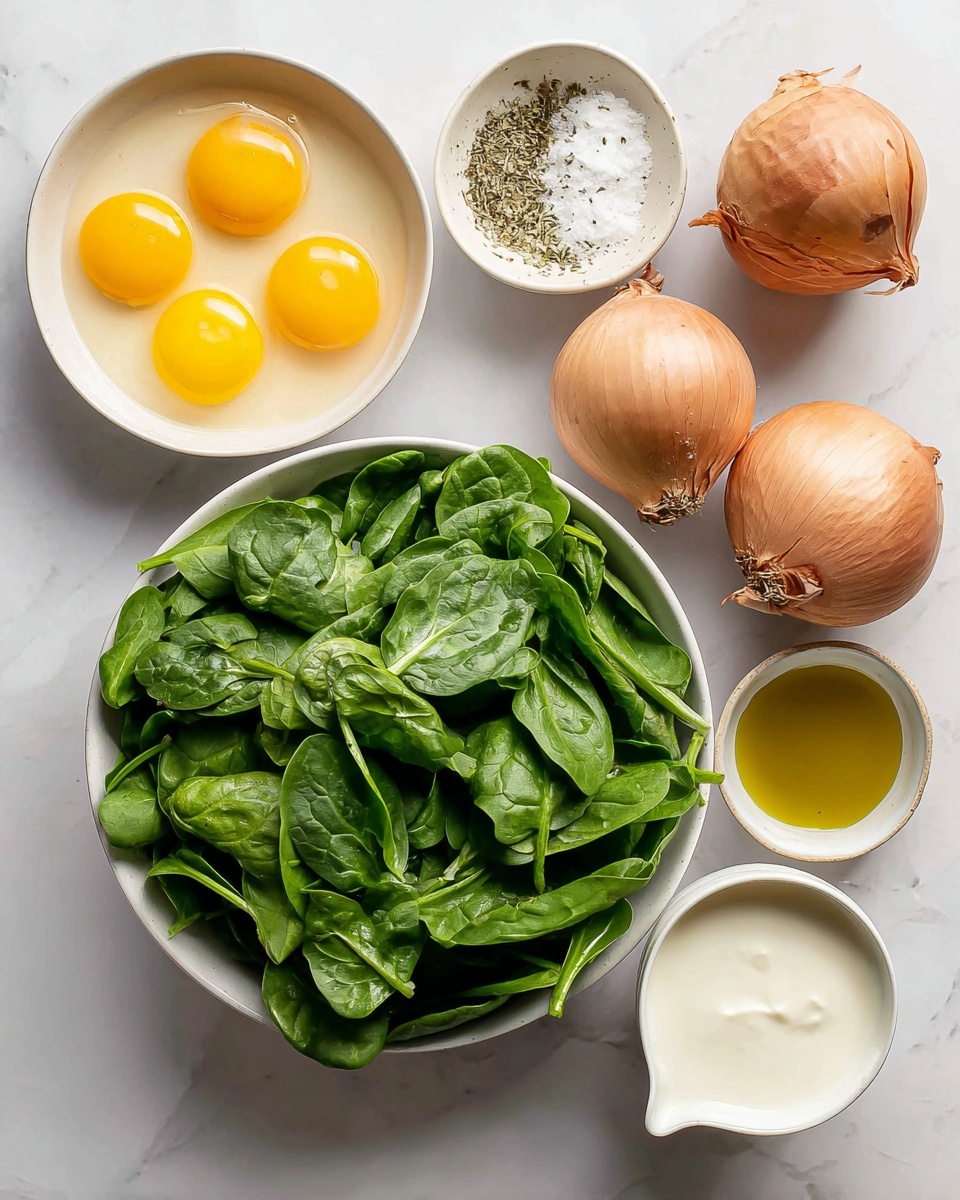Crustless Spinach Quiche (Gluten-Free, Dairy-Free) Recipe 4 A white bowl filled with fresh, green spinach leaves takes up the bottom center of the image; above it, there are five raw eggs with bright yellow yolks in a white bowl to the left, a small white bowl with mixed salt and herbs slightly to the right, two whole brown onions to the far right, a white bowl filled with creamy off-white almond milk below the onions, and a small white bowl with golden-yellow oil near the bottom right. All items are placed on a white marbled surface. Photo taken with an iphone --ar 4:5 --v 7