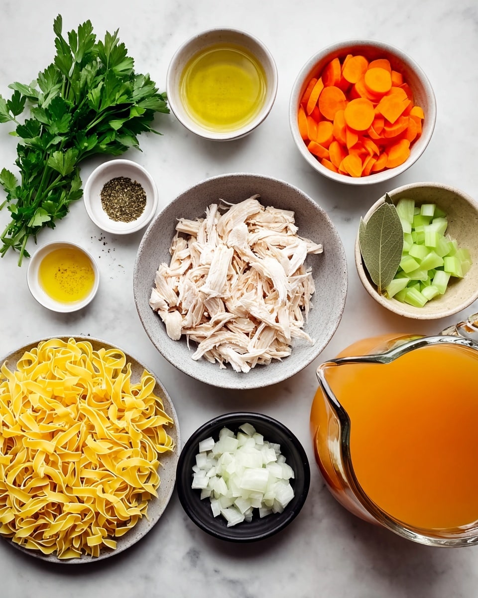 The image shows various ingredients placed on a white marbled surface. There are four nests of yellow egg noodles on the left side next to some green parsley leaves. In the center, a grey bowl holds shredded white chicken. Surrounding this are small white bowls: one with orange carrot slices on the top center, one with pale green celery pieces on the top right, a small white bowl with two bay leaves to the right, a small beige bowl with chopped minced garlic in the middle right, and a small black bowl with white diced onions at the bottom right. At the top left, there are two small bowls side by side, one with golden oil and the other with black pepper. There is an additional small dark grey bowl with white salt above the garlic. Finally, on the right edge, there is a large glass measuring jug filled with orange chicken broth. The photo taken with an iphone --ar 4:5 --v 7
