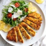 Crispy Chicken Milanese with Arugula, Tomatoes, and Shaved Parmesan Recipe