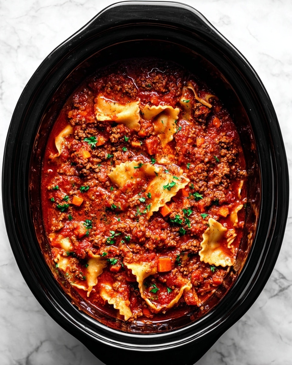 The image shows a black slow cooker filled with a rich, red tomato sauce mixed with browned ground meat and small diced carrots. Wide, flat lasagna noodles with ruffled edges are layered throughout the sauce, some partially submerged, some visible on top, creating a mix of smooth and wavy textures. Fresh green parsley pieces are sprinkled over the dish, adding a bright contrast to the deep red and brown colors. The slow cooker rests on a white marbled surface. Photo taken with an iphone --ar 4:5 --v 7