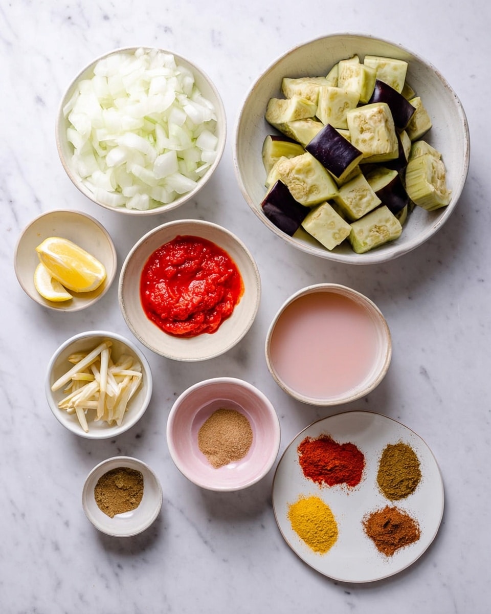 A top-down view of eight white bowls arranged on a white marbled surface. The largest bowl at top right holds large cubes of eggplant with light green and purple skin. Below it to the left is a medium bowl filled with finely chopped white onions. To the left of that is a small bowl with a wedge of lemon. Above the onions is a small bowl with thin slices of green chili, ginger sticks, and minced garlic. At top left is a medium bowl containing bright red tomato paste. Below that, in the center, is a small bowl with a brown powdered spice. To the right of that is a pink bowl holding a light pink liquid. At the bottom right is a small white plate with four different powdered spices in neat piles: light brown, reddish-orange, bright yellow, and dark brown. Photo taken with an iphone --ar 4:5 --v 7