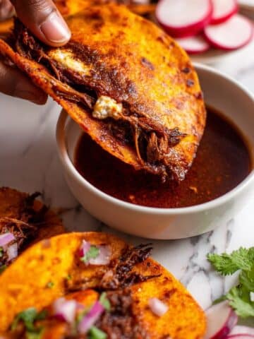 Crispy Birria Tacos with Melted Oaxacan Cheese and Fresh Garnishes Recipe
