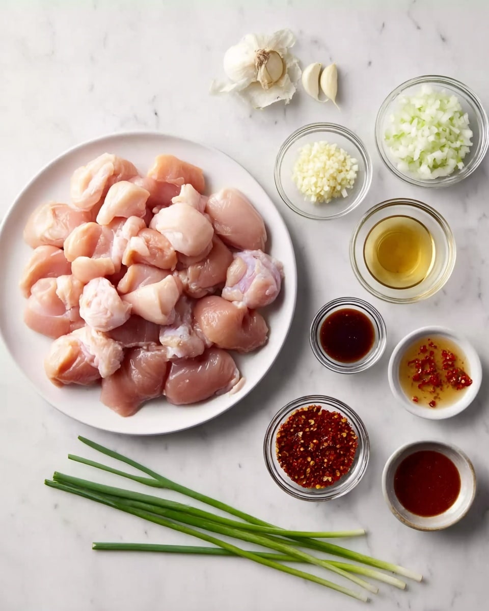 The image shows a white plate on the left piled with many raw chicken pieces that are light pink and smooth. To the right of the plate, there are small white bowls and glass cups arranged neatly on a white marbled surface. Each bowl contains different ingredients: a small bowl of chopped white onions, a small bowl of minced garlic cloves, a small bowl of a dark red sauce, a small bowl of a light brown sauce, another bowl with a clear liquid, and a bowl with a reddish-brown sauce with visible chili flakes. There are also three green onions lying flat in front of the bowls. Everything is displayed clearly and cleanly on the white marbled background. photo taken with an iphone --ar 4:5 --v 7