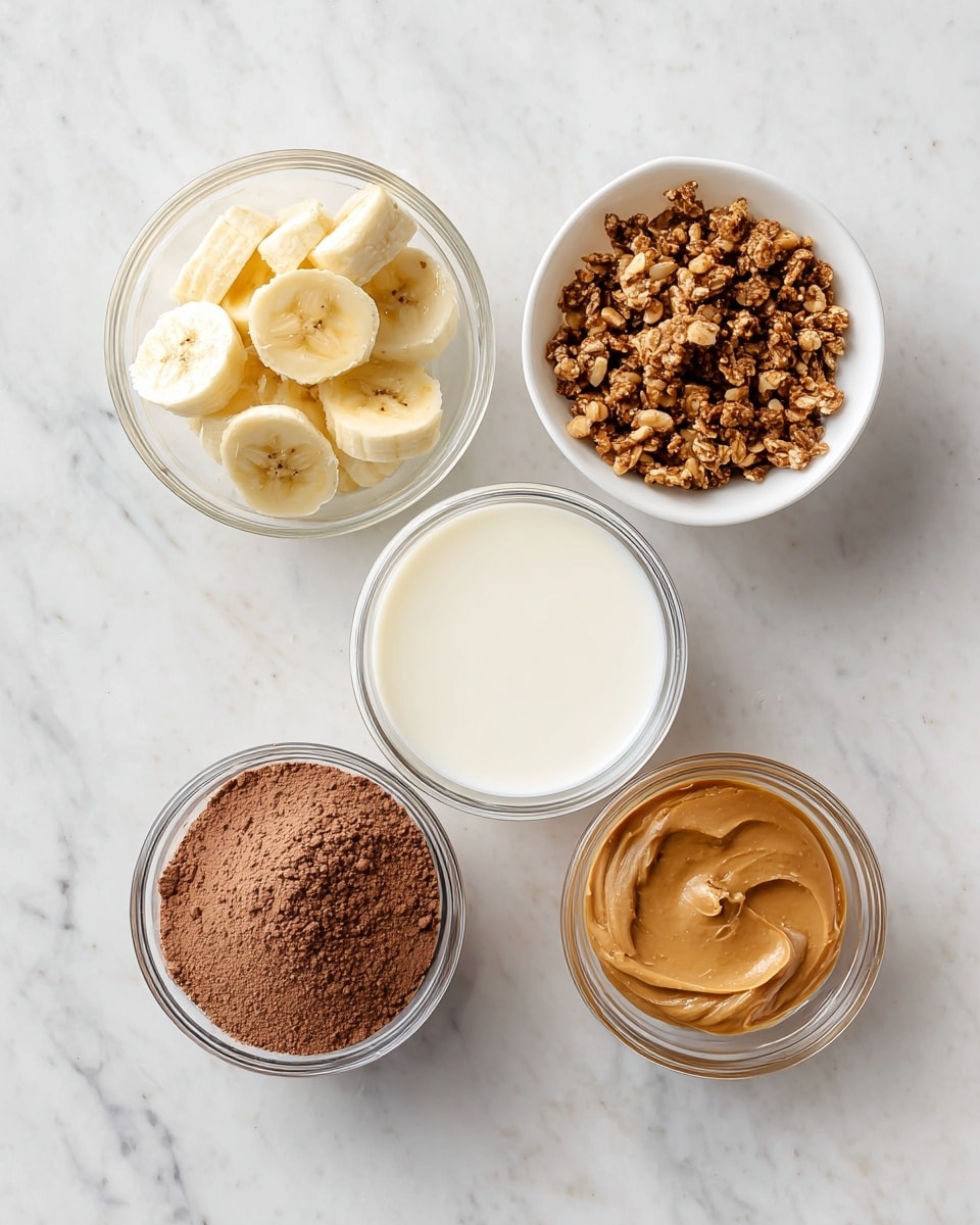 The image shows five small clear bowls placed on a white marbled surface. Starting from the top left, the first bowl holds sliced banana pieces, light yellow in color with a soft texture. To the top right, there is a white bowl filled with granola or nuts, consisting of small, crunchy clusters in shades of brown. Centered below the banana bowl, a clear bowl contains milk, smooth and white. To the bottom left, another clear bowl is filled with chocolate protein powder, a fine brown powder with a slightly uneven surface. Lastly, to the bottom right, a clear bowl holds peanut butter, creamy with a rich brown hue and smooth texture. photo taken with an iphone --ar 4:5 --v 7