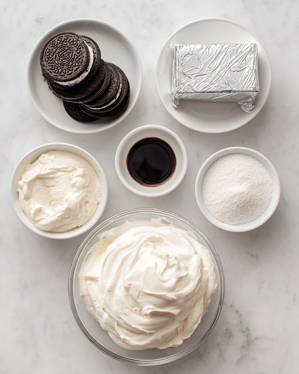 A top view of five white bowls and a block of cream cheese arranged on a white marbled surface, each containing a different ingredient. The top left bowl is filled with dark brown Oreo cookies stacked on each other, while next to it on the right is a small bowl with dark brown vanilla extract. Below the Oreos is a wrapped silver block of cream cheese, and to the right of it is a white bowl filled with fine white powdered sugar. At the bottom center is a large clear glass bowl filled with smooth, fluffy white whipped topping. The layout is simple and clean with clear labels for each ingredient. Photo taken with an iphone --ar 4:5 --v 7