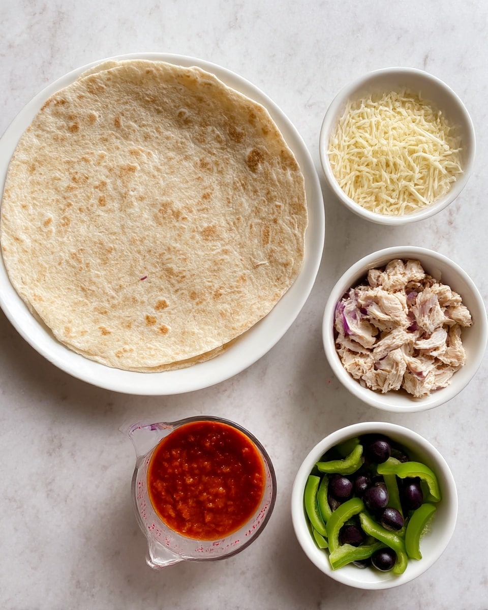 The image shows five separate white dishes arranged on a white marbled surface. The largest dish holds a whole round flatbread with a light brown, textured surface that looks soft and thin. There is a small white bowl of shredded pale yellow cheese, another small white bowl filled with red tomato sauce having a smooth yet thick texture, and a measuring cup containing small pieces of cooked, light brown chicken. The last white bowl has bright green sliced bell peppers, purple sliced onions, and black sliced olives mixed together. Photo taken with an iphone --ar 4:5 --v 7