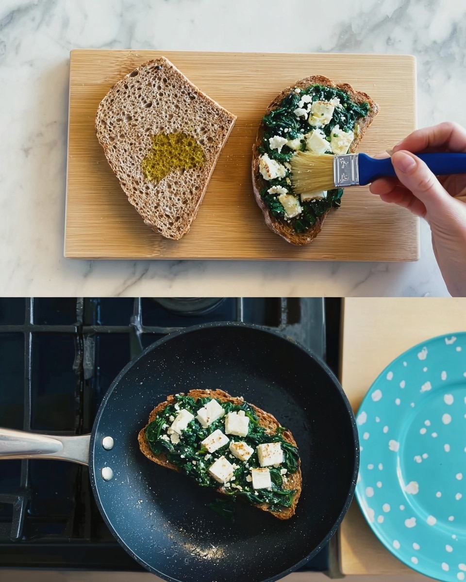 The first image shows two large slices of brown bread on a small wooden cutting board placed on a white marbled surface. A woman's hand holds a small brush applying a layer of oil on the bread's light brown textured surface with visible grains. In the second image, two pieces of the brown bread are in a black pan on a stove. Each bread slice is topped with a thick layer of cooked dark green spinach, scattered with small uneven white cheese pieces on top. Nearby is a part of a light blue plate with white dots. Photo taken with an iphone --ar 4:5 --v 7