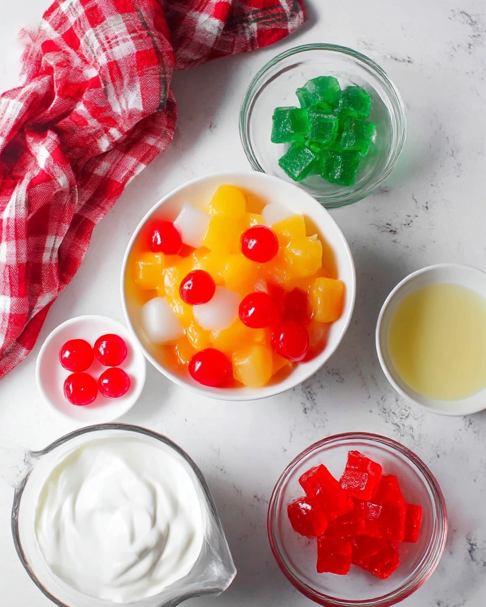A white bowl filled with mixed fruit pieces in yellow, orange, translucent white, and red colors, topped with bright red cherries, sits in the center. Around it, three small clear glass bowls hold shiny green jelly cubes, shiny red jelly cubes, and a pale yellow liquid sauce. There is a small white bowl with three maraschino cherries on the side. At the bottom left, there is a clear measuring cup filled with thick white cream. A crumpled red checkered cloth is placed toward the upper left, all set on a white marbled textured surface photo taken with an iphone --ar 4:5 --v 7