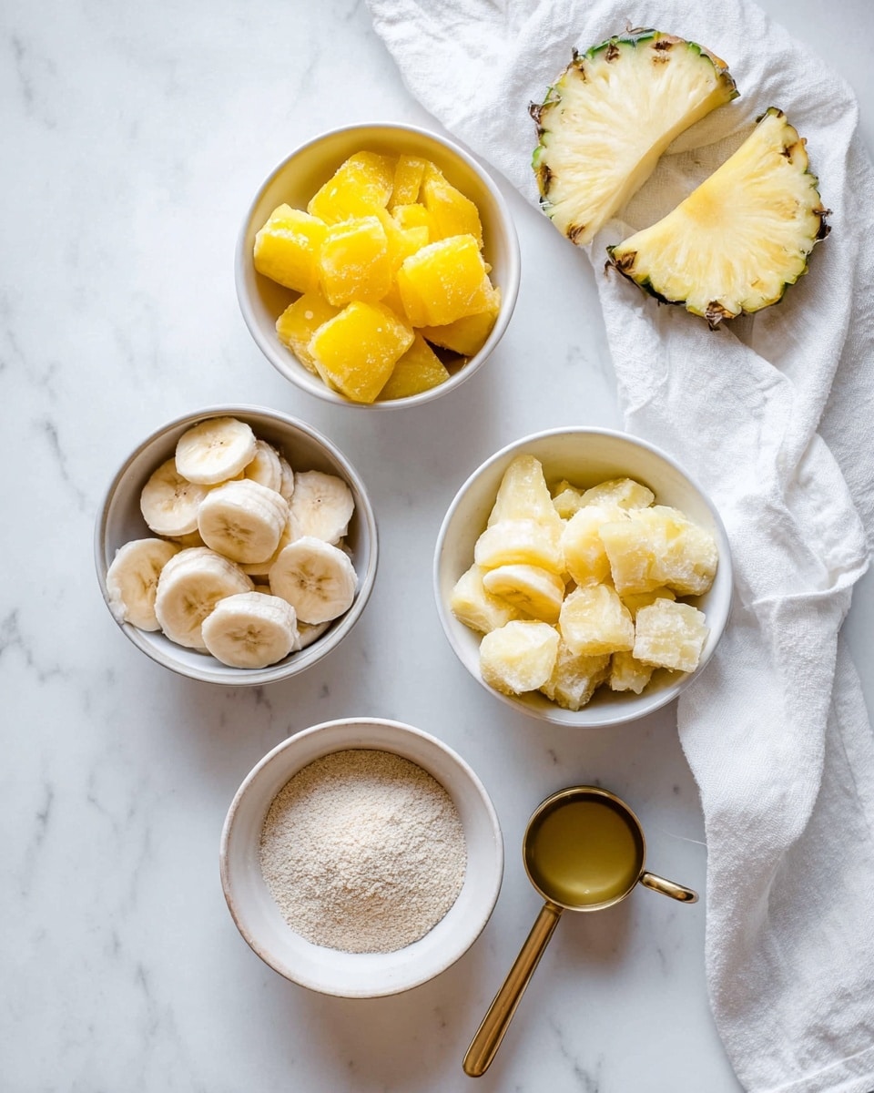 A top view of five white bowls on a white marbled surface arranged in a loose cross shape with a white cloth and sliced pineapple on the top right corner. The top bowl holds bright yellow frozen mango chunks with a rough icy texture. To the right, a bowl contains pale yellow frozen pineapple pieces with a frosty finish. Below, a bowl has light beige powder, looking soft and crumbly. To the left, a bowl contains round slices of frozen banana with a light brown color and frosty texture. The bottom right bowl holds a golden metal measuring spoon partially filled with a clear liquid. photo taken with an iphone --ar 4:5 --v 7
