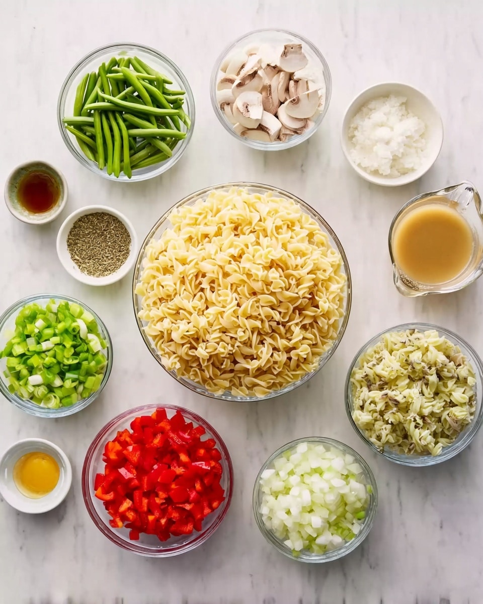 The image shows ten clear glass bowls arranged on a white marbled surface, each filled with different ingredients for cooking. In the center is a large bowl filled with pale yellow curly pasta. Around it are smaller bowls: one with bright green sliced asparagus spears, another with small white diced onions, a third with bright red chopped bell peppers, and one with light green chopped celery. There is also a bowl containing small white mushroom pieces, a bowl with white sour cream, a bowl with light beige parmesan cheese, a small bowl with light yellow cooking oil, a measuring cup holding a light brown broth, and a tiny bowl with dried herbs. All ingredients are neatly displayed and colorful, creating a fresh and organized look. Photo taken with an iphone --ar 4:5 --v 7