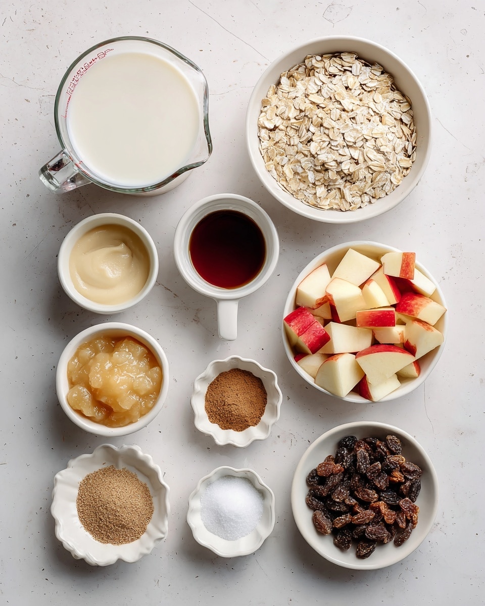 The image shows various baking ingredients arranged neatly on a white marbled surface. From top left, there is a clear glass measuring cup filled with smooth white non-dairy milk. Next to it, on the right, is a white bowl filled with pale beige rolled oats. Below the milk, a small white cup contains dark brown maple syrup. On the right side of the syrup, a tiny white scalloped bowl holds light brown ground flaxseed. To the right, a small white dish is divided into three parts, with dark brown cinnamon, white sea salt, and light baking powder powders. Below this, a small clear glass bowl contains creamy pale yellow unsweetened applesauce. Next to it, slightly to the right, is a small white bowl with clear coconut oil. Below the applesauce, a white bowl holds chopped red and cream diced apples. To the right of the apples, a white bowl is filled with dark brown raisins. Finally, a small white dish near the raisins contains dark brown vanilla extract. The ingredients are spaced out evenly on the smooth, light background. Photo taken with an iphone --ar 4:5 --v 7